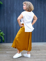 A NAIMA SILK FEEL SKIRT IN GOLD