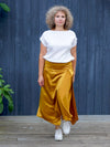 A NAIMA SILK FEEL SKIRT IN GOLD