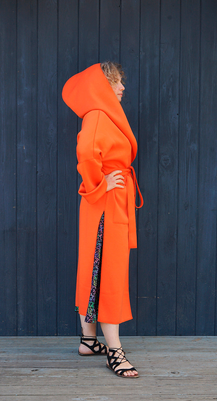 A MELODY COAT IN ORANGE